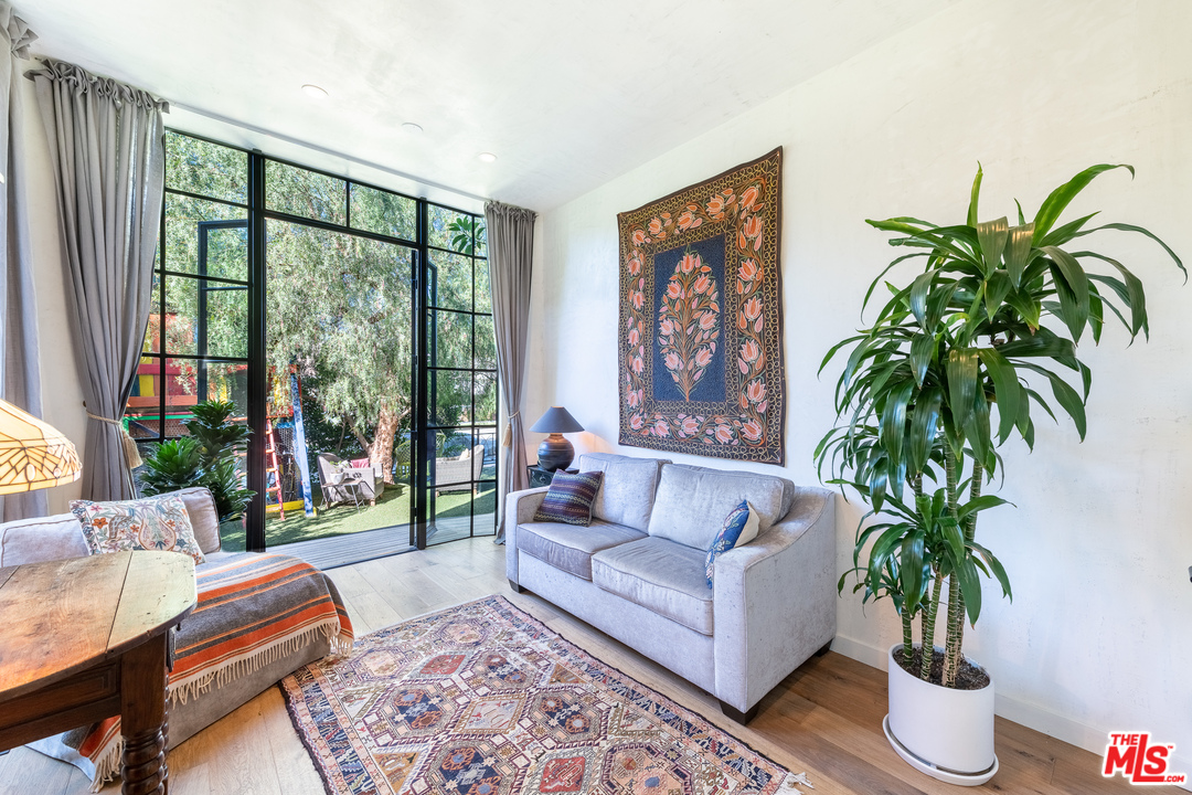 910 Dickson Street Marina del Rey, CA 90292 - Photo 23 of 52 a living room with furniture and a potted plant