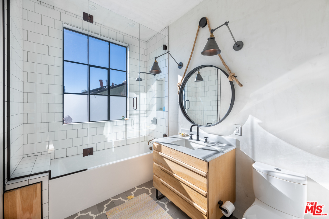 910 Dickson Street Marina del Rey, CA 90292 - Photo 32 of 52 a bathroom with a sink and a mirror
