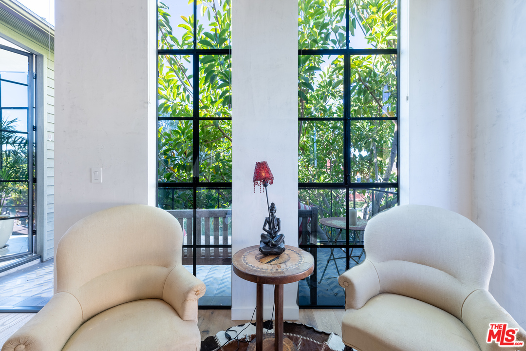 910 Dickson Street Marina del Rey, CA 90292 - Photo 34 of 52 a living room with furniture and a large window