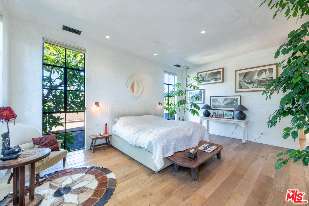 910 Dickson Street Marina del Rey, CA 90292 - Photo 35 of 52 a bedroom with a bed window and potted plant