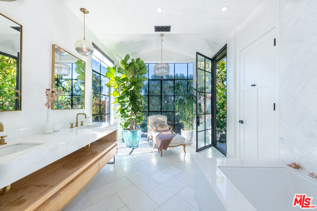 910 Dickson Street Marina del Rey, CA 90292 - Photo 37 of 52 a very nice looking room with a large window and chandelier