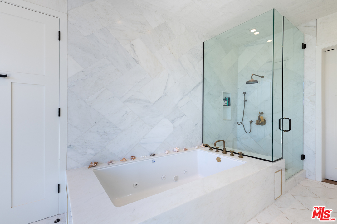 910 Dickson Street Marina del Rey, CA 90292 - Photo 39 of 52 a bathroom with a bathtub and a shower