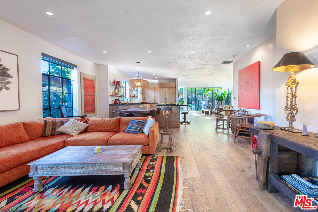 910 Dickson Street Marina del Rey, CA 90292 - Photo 9 of 52 a living room with furniture a rug and a book shelf