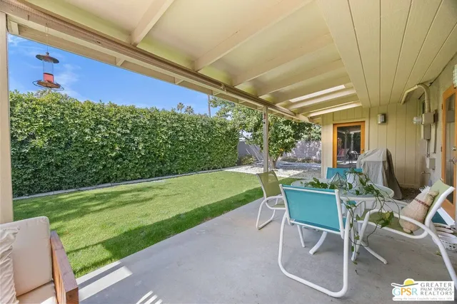 a view of a chairs and tables in the patio