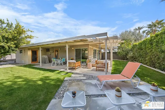 a view of a house with backyard porch and patio
