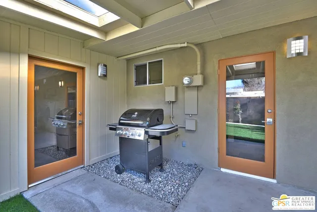 a living room with a toilet and a sink
