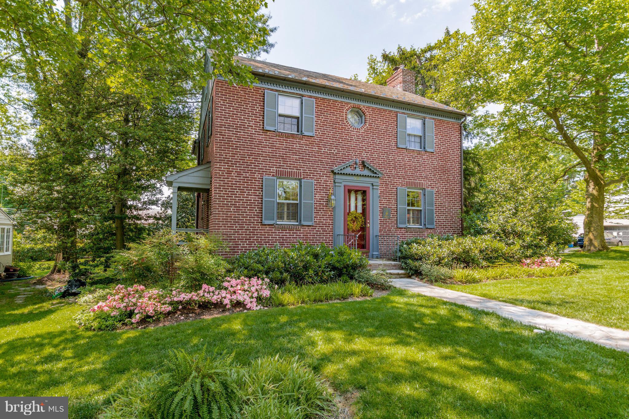 901 Kingston Road Baltimore, MD 21212 - Photo 1 of 27 a brick house with a yard plants and large tree