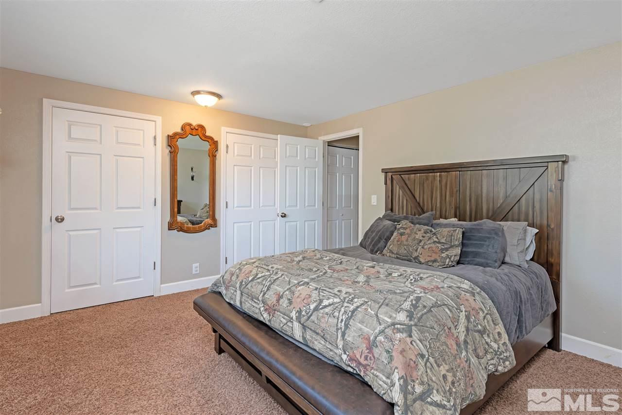 117 Ring Road Dayton, NV 89403 - Photo 16 of 36 a bedroom with a large bed and a closet
