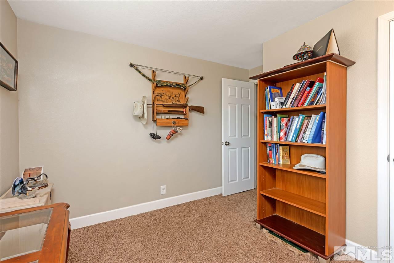117 Ring Road Dayton, NV 89403 - Photo 20 of 36 a view of room with shelf and book shelf