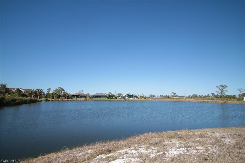 26 Harness Road Placida, FL 33946 - Photo 23 of 26 a view of a lake with houses in the back
