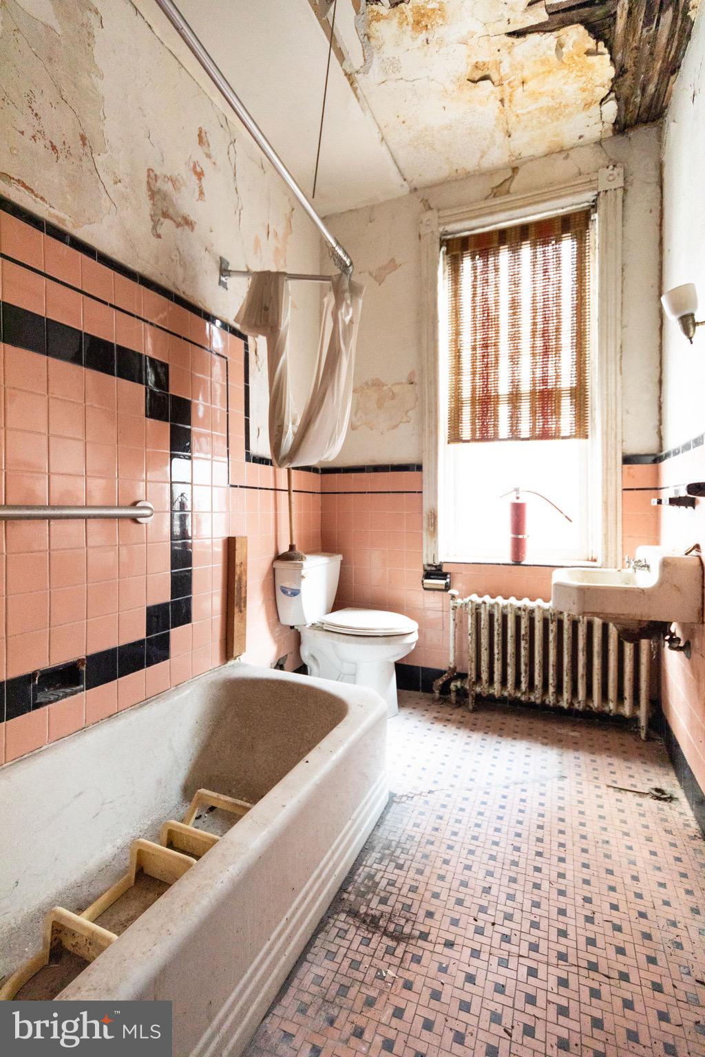2312 Reed Street Philadelphia, PA 19146 - Photo 15 of 23 a bedroom with furniture and a large window