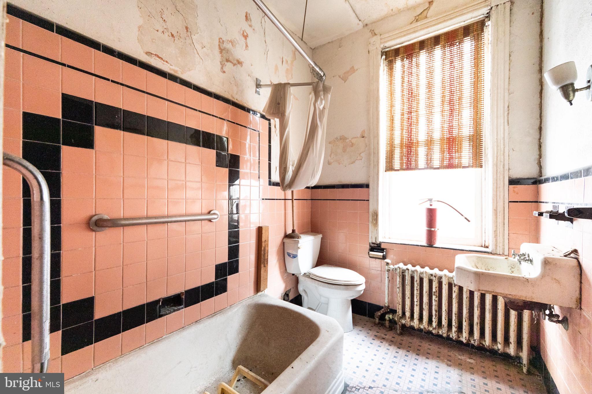 2312 Reed Street Philadelphia, PA 19146 - Photo 16 of 23 a bathroom with a sink toilet and shower