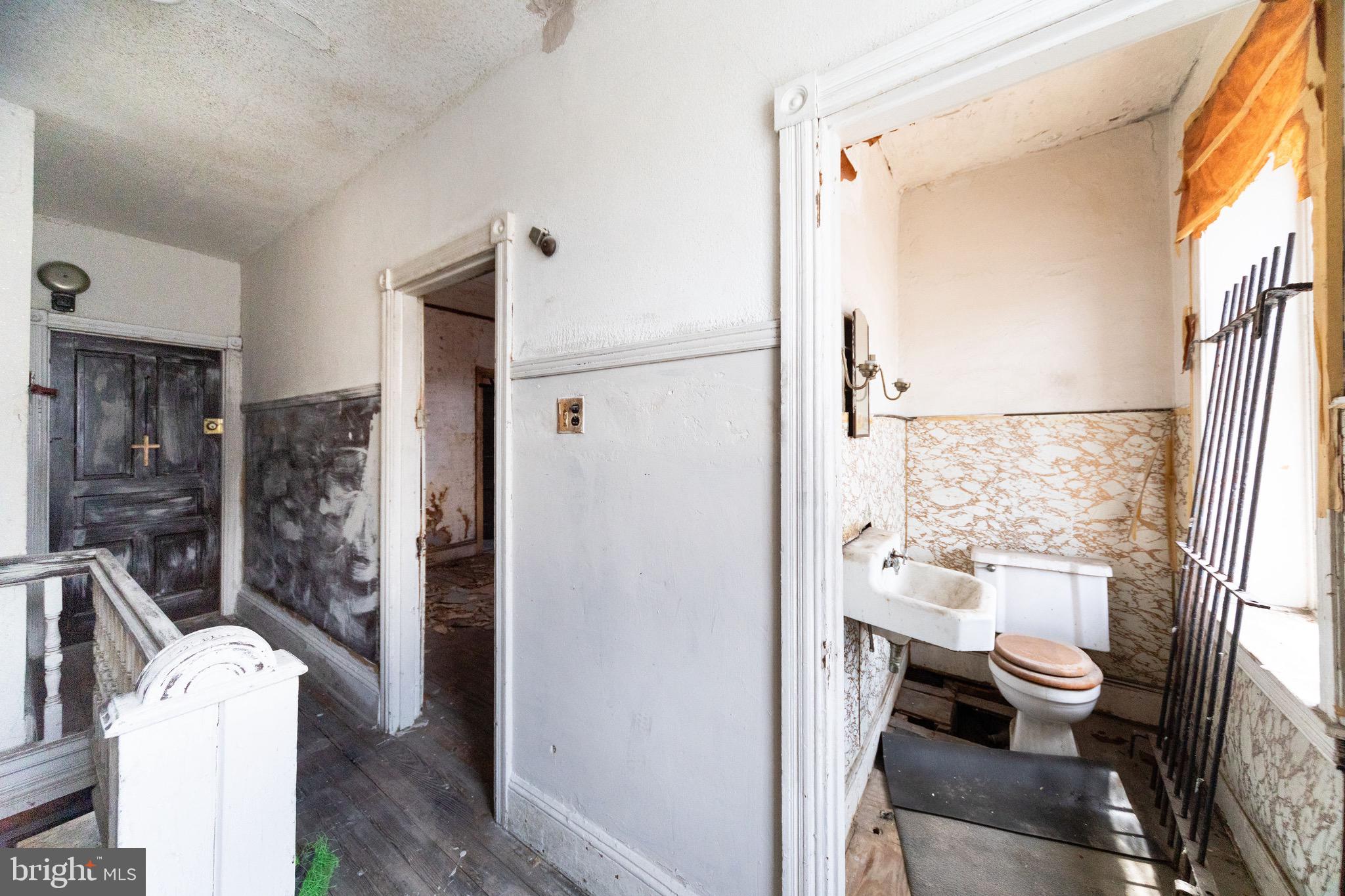 2312 Reed Street Philadelphia, PA 19146 - Photo 19 of 23 a bathroom with a sink toilet and shower