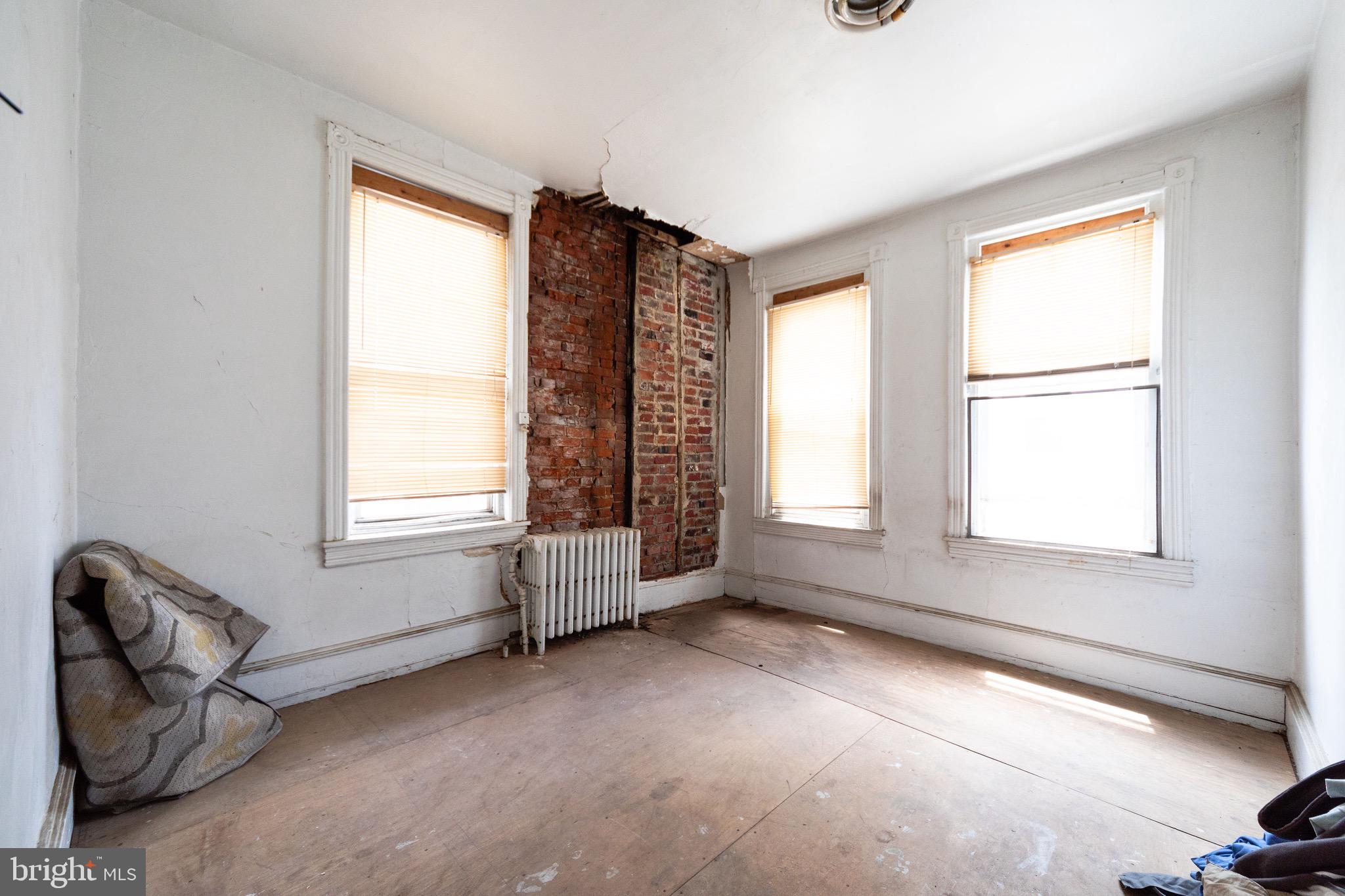 2312 Reed Street Philadelphia, PA 19146 - Photo 23 of 23 a view of livingroom with furniture hardwood and windows