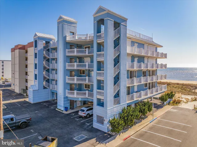 a view of a swimming pool with a table and chairs