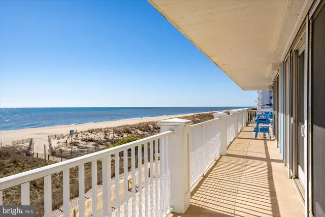 a view of a balcony with an ocean view