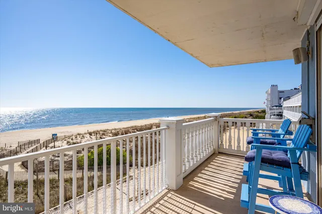a view of dining room with furniture and a chandelier