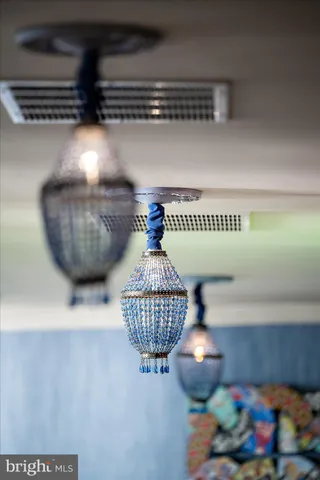 a view of a dining room with furniture water view and wooden floor
