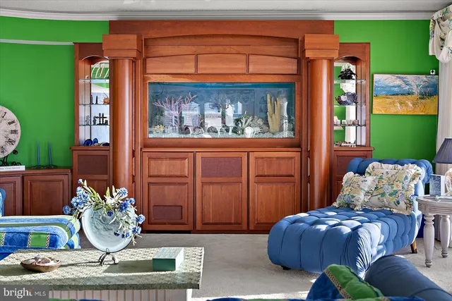 a view of kitchen with stainless steel appliances granite countertop a refrigerator and a stove