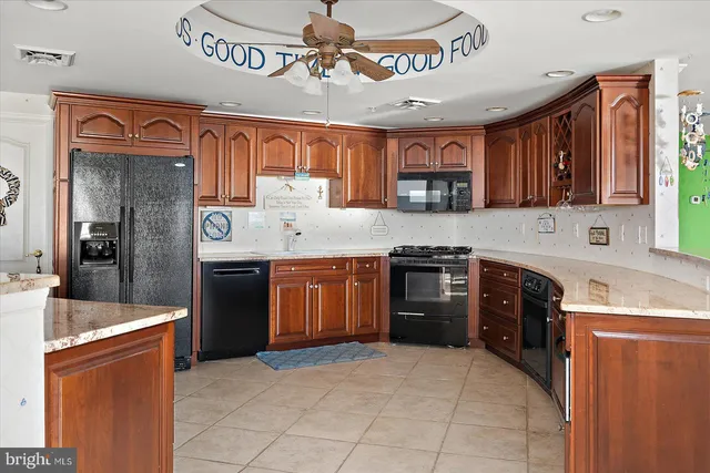 a bathroom with a toilet a sink a mirror a vanity and shower