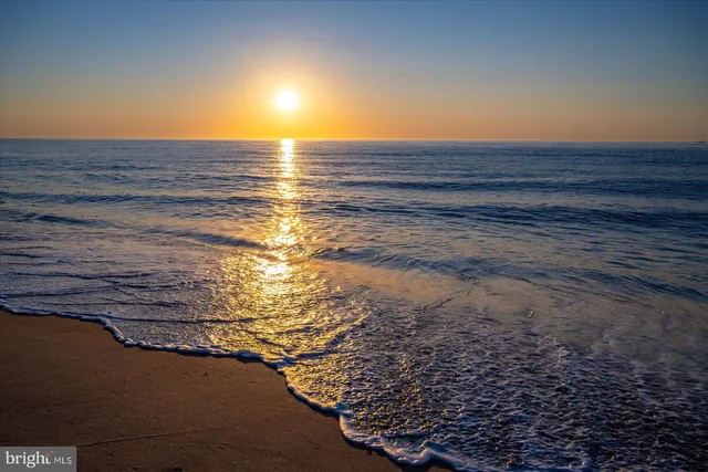 a view of a balcony with wooden floor and fence