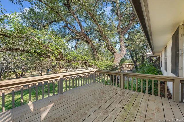 a view of balcony with wooden floor