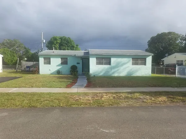 a view of house with a swimming pool