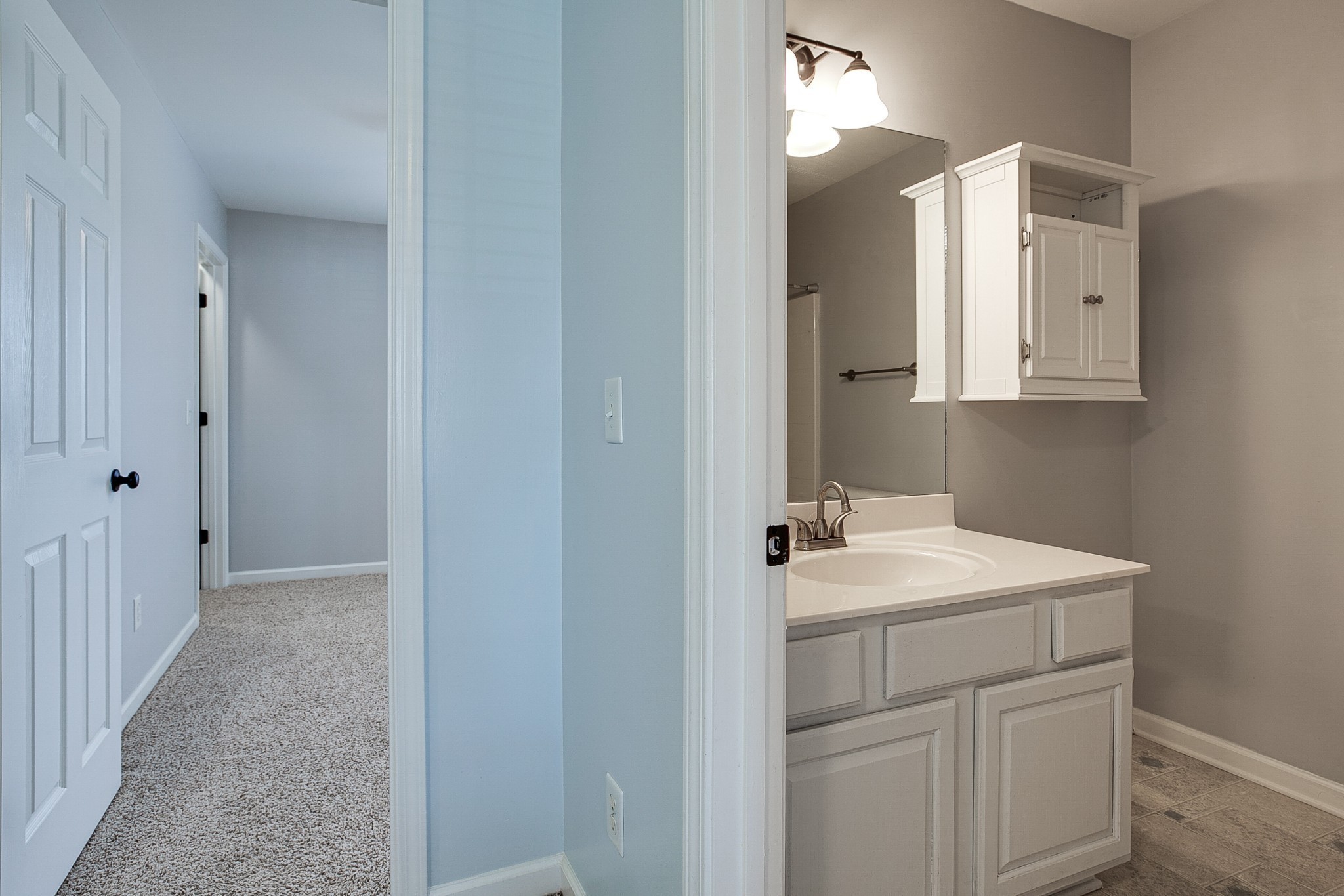 1715 Emma Circle Spring Hill, TN 37174 - Photo 17 of 23 a bathroom with a sink and a mirror