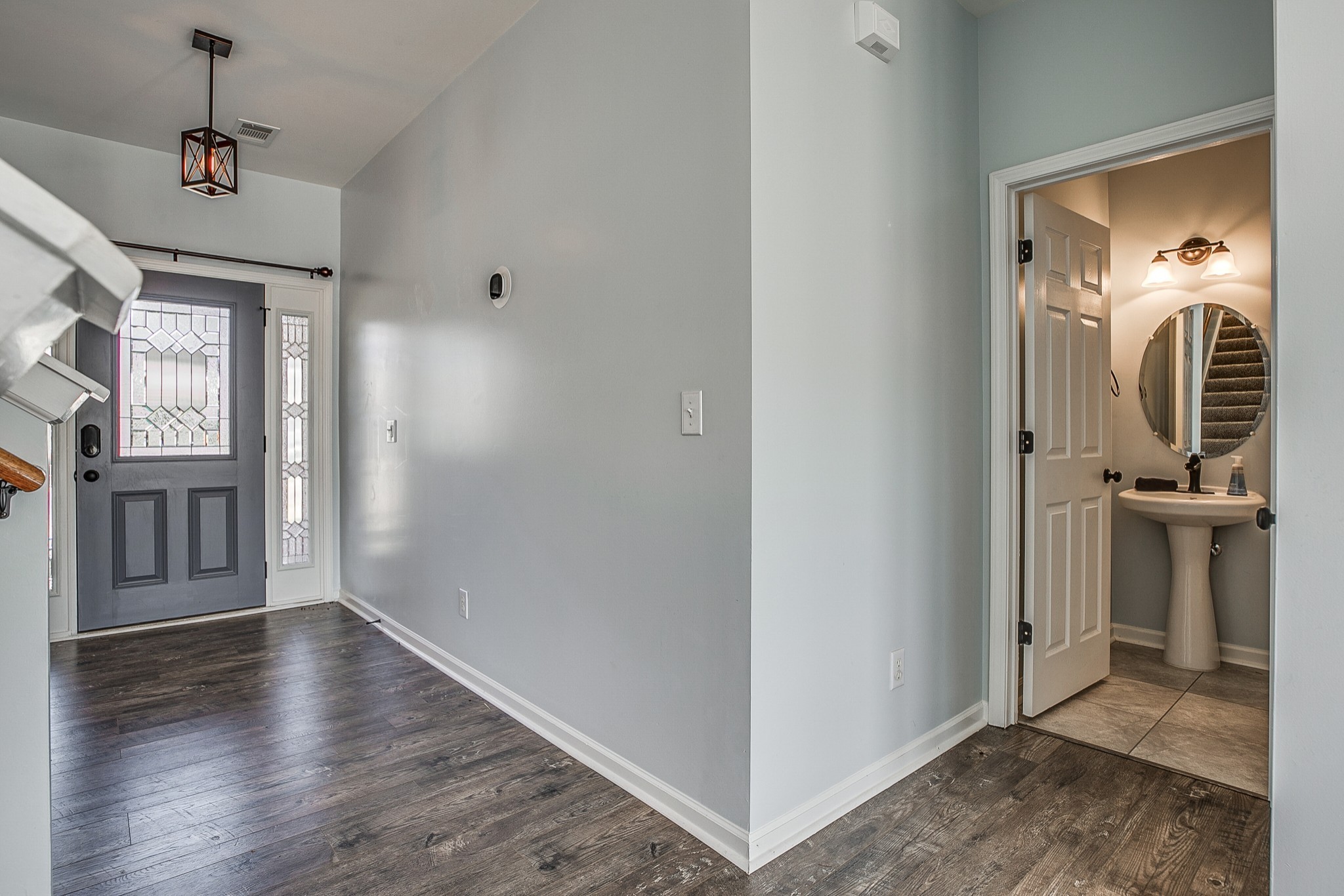 1715 Emma Circle Spring Hill, TN 37174 - Photo 3 of 23 a view of a hallway with wooden floor and windows