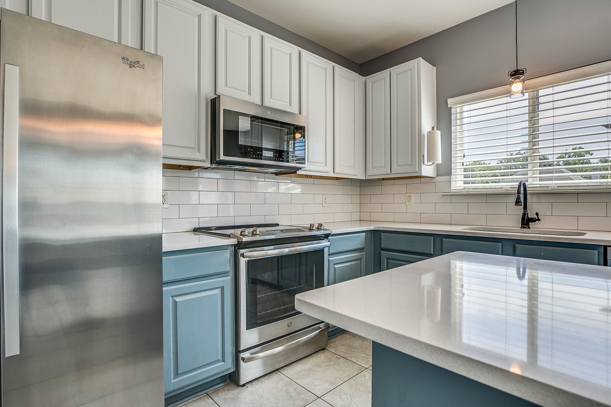 1715 Emma Circle Spring Hill, TN 37174 - Photo 8 of 23 a kitchen with stainless steel appliances granite countertop a sink stove and microwave