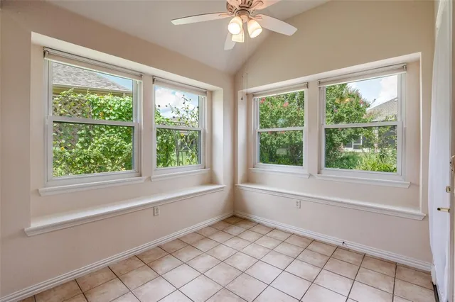 a kitchen with granite countertop a sink stove and refrigerator