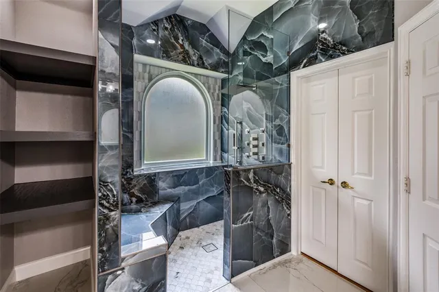 a bathroom with a double vanity sink and a mirror