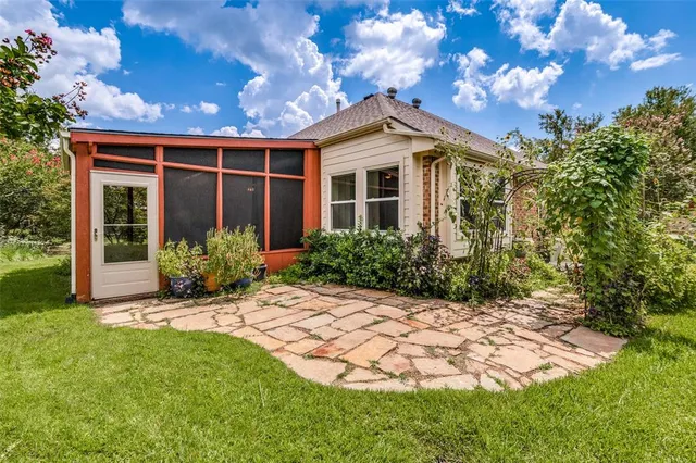 an empty room with wooden floor and walls