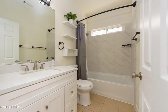 a bathroom with a sink toilet tub and shower