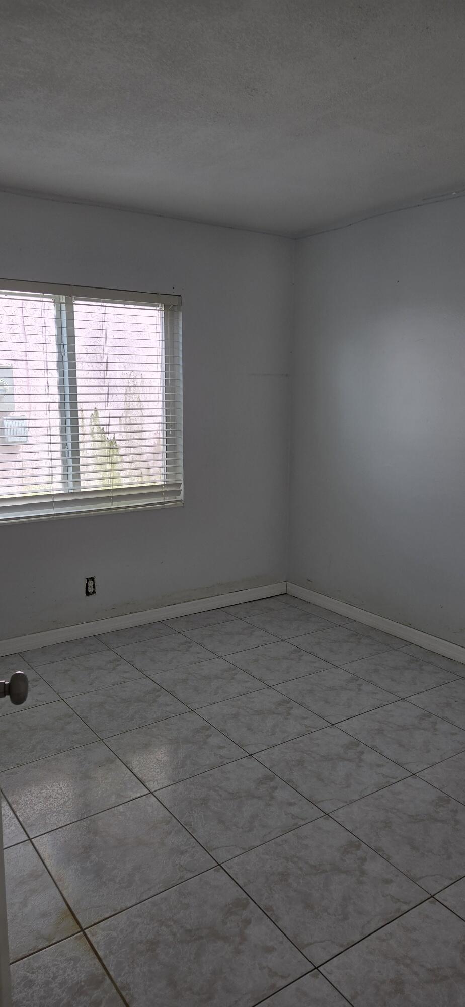 6158 Westfall Road Lake Worth, FL 33463 - Photo 21 of 24 a view of a window in an empty room