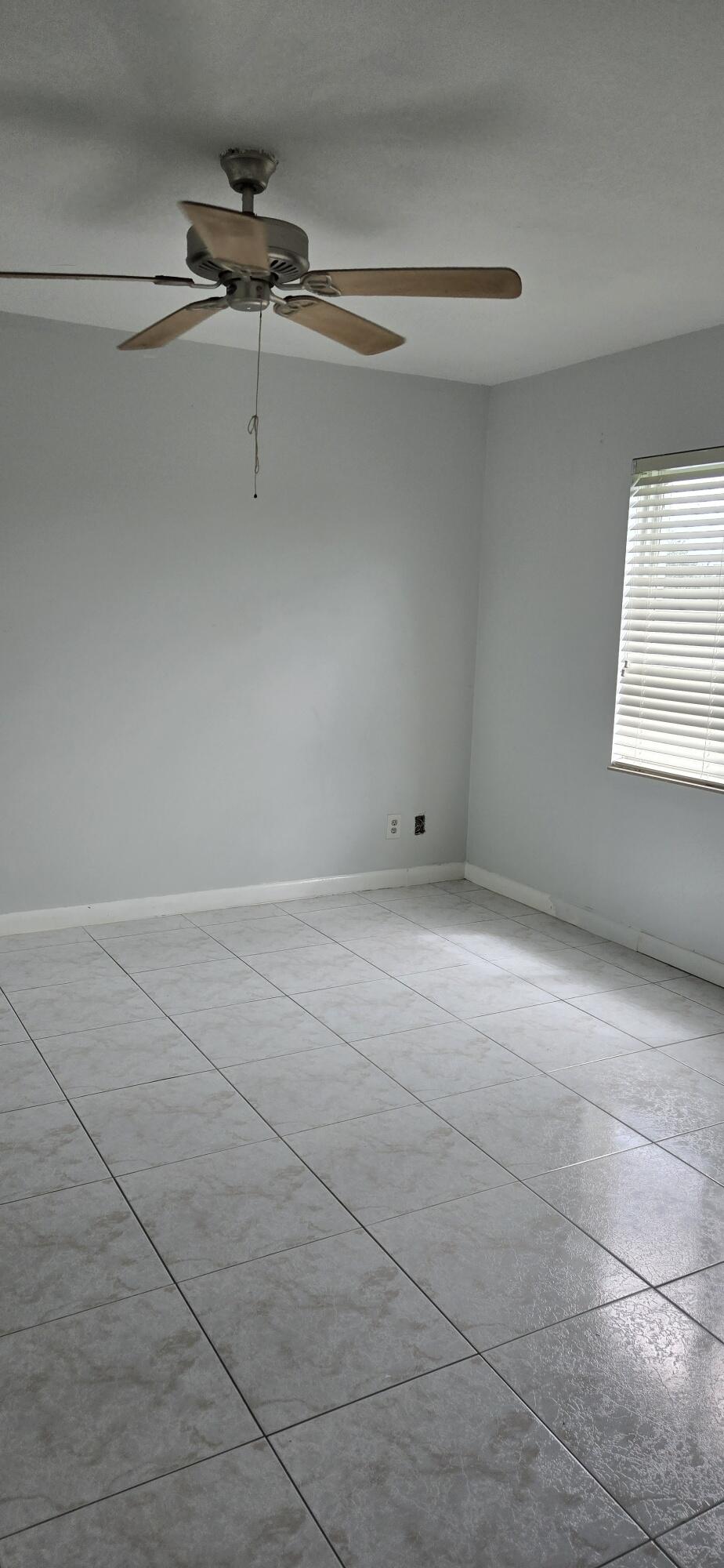 6158 Westfall Road Lake Worth, FL 33463 - Photo 8 of 24 a view of a room with rack on the wall