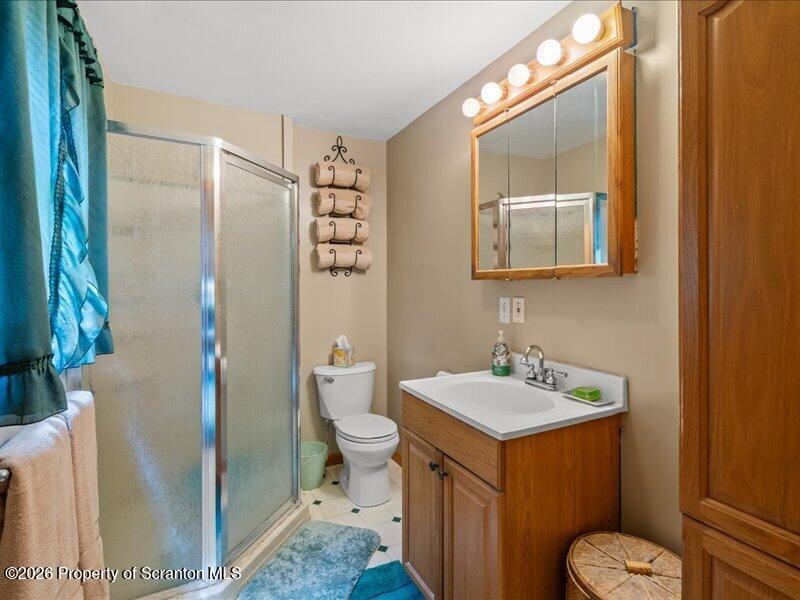 71 Pleasant Avenue Thompson, PA 18465 - Photo 25 of 37 a bathroom with a sink toilet and shower