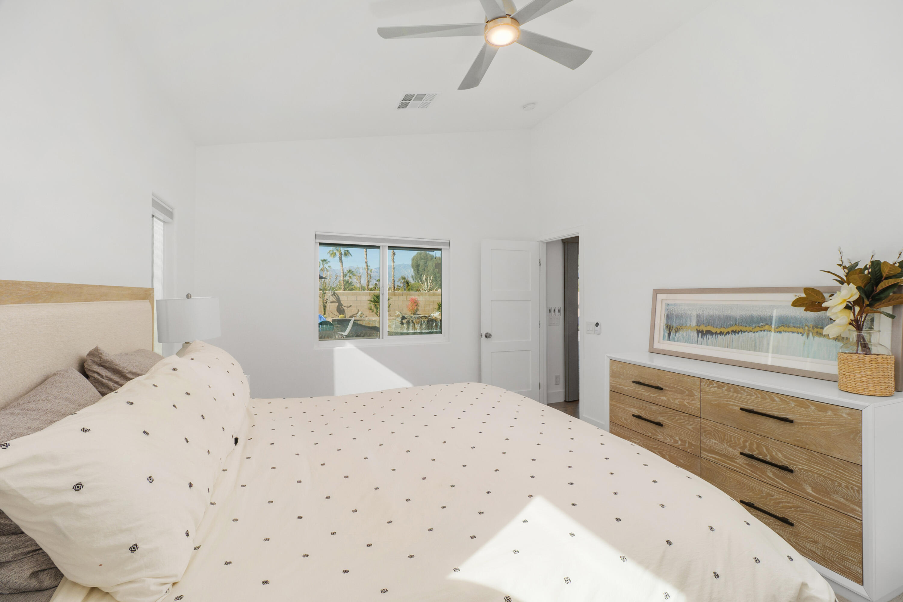 45703 Crosswater Street Indio, CA 92201 - Photo 16 of 41 a bedroom with a bed and a dresser