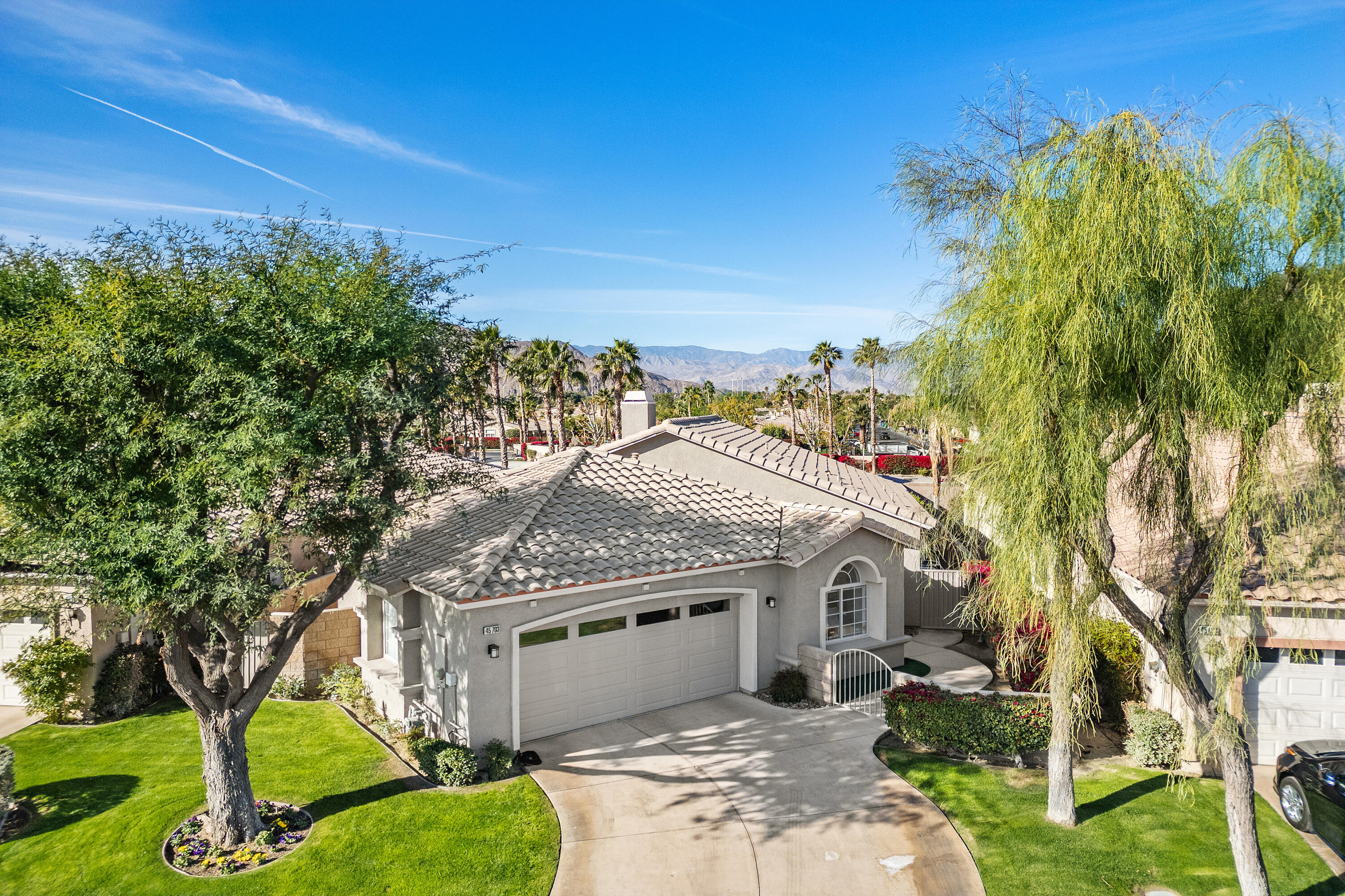 45703 Crosswater Street Indio, CA 92201 - Photo 2 of 41 a front view of a house with a yard