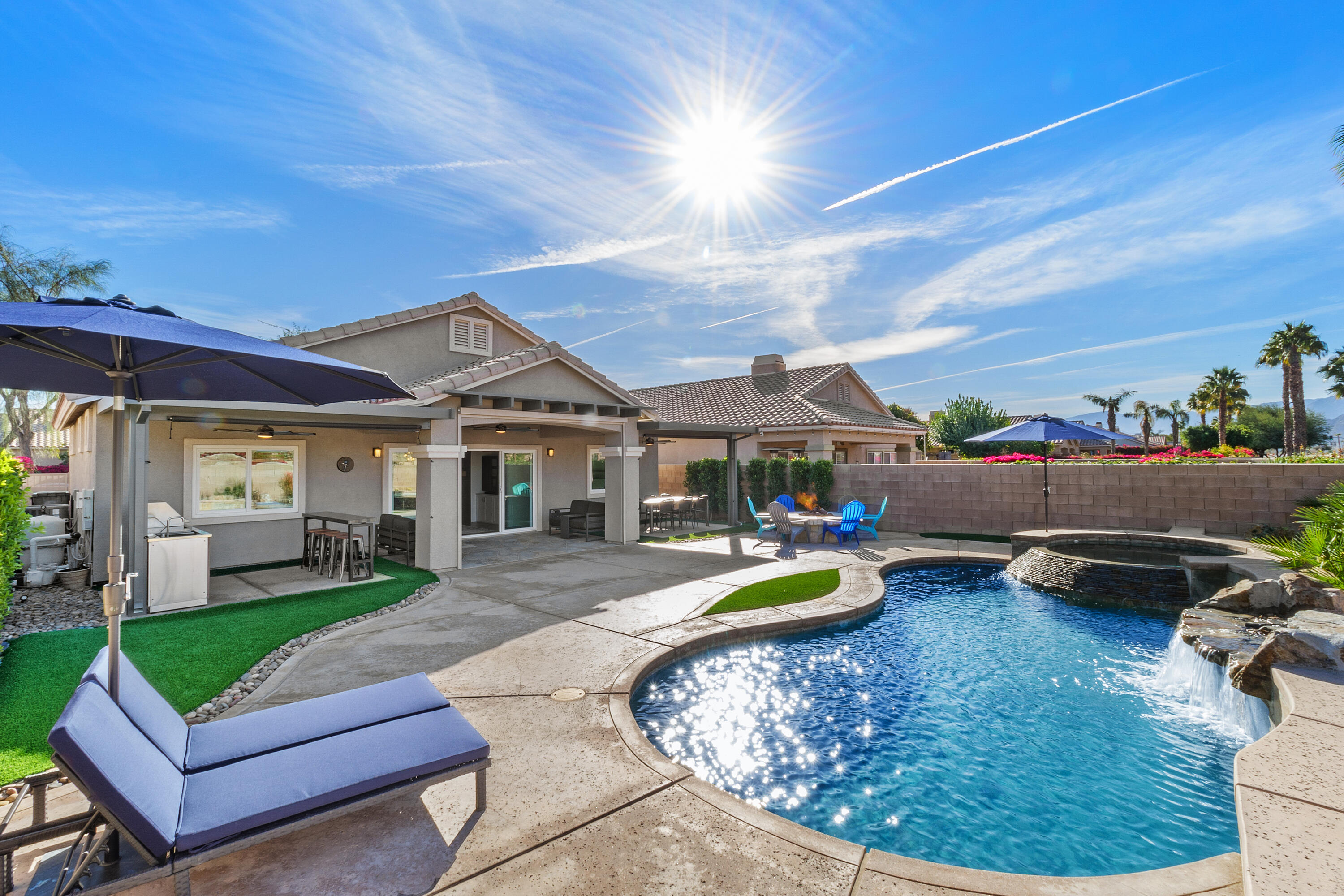 45703 Crosswater Street Indio, CA 92201 - Photo 30 of 41 a view of a house with swimming pool and porch