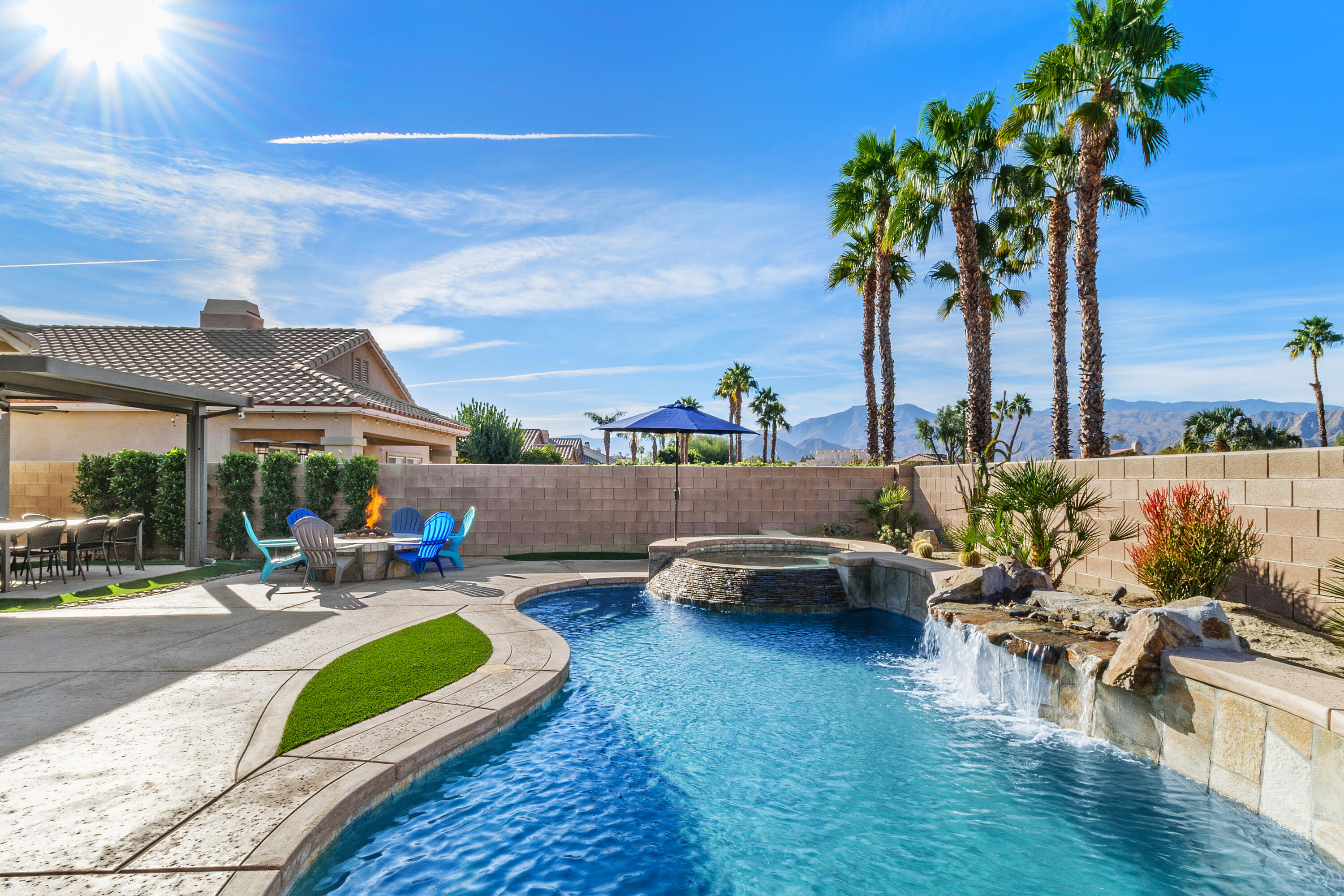 45703 Crosswater Street Indio, CA 92201 - Photo 31 of 41 a view of a backyard with swimming pool and sitting area