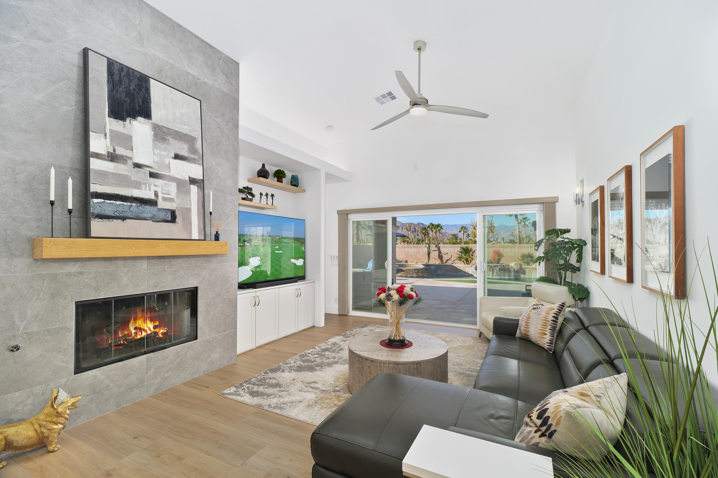 45703 Crosswater Street Indio, CA 92201 - Photo 6 of 41 a living room with furniture fireplace and a large window