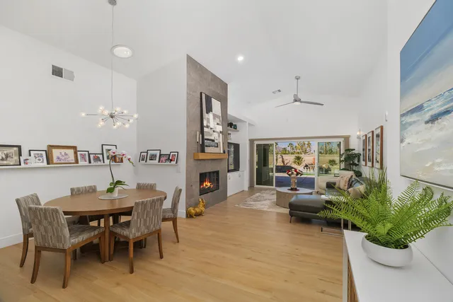 a living room with furniture fireplace and garden view