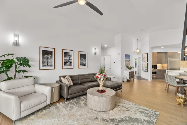 a kitchen with a table chairs and a chandelier