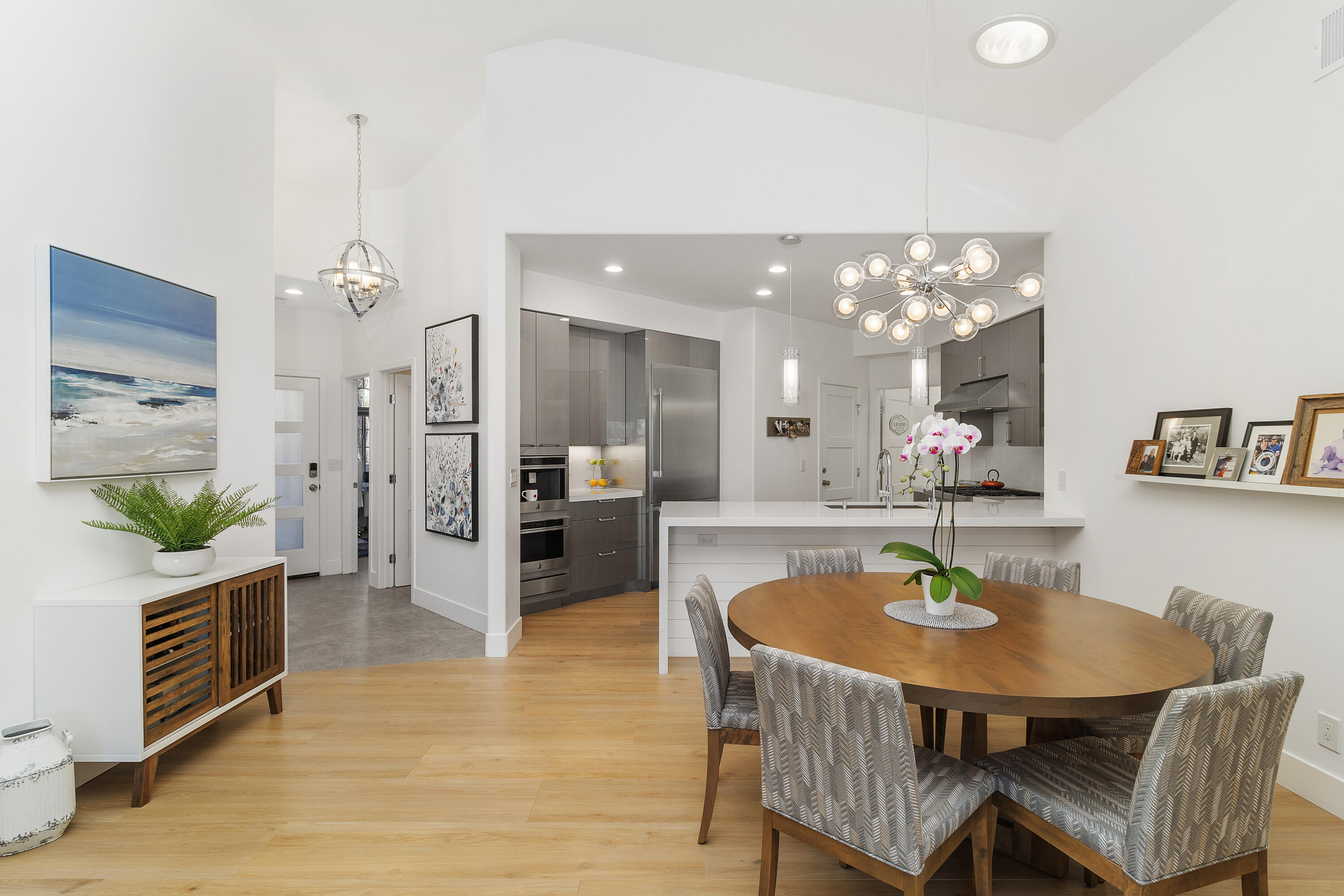 45703 Crosswater Street Indio, CA 92201 - Photo 9 of 41 a kitchen with a table chairs and a chandelier