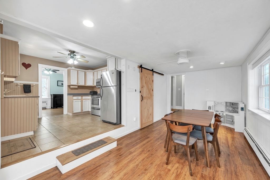 106 Granville Road Westfield, MA 01085 - Photo 17 of 42 a view of a dining room with furniture and wooden floor