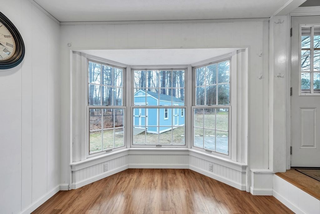 106 Granville Road Westfield, MA 01085 - Photo 19 of 42 an empty room with wooden floor and windows