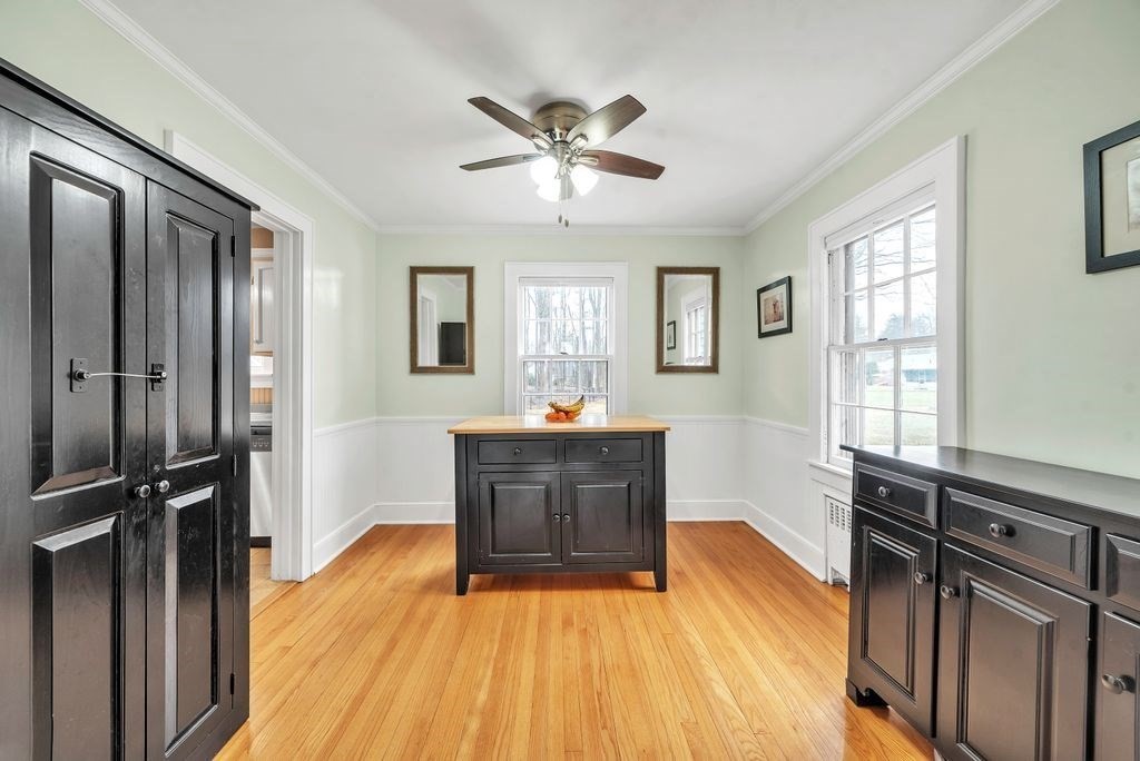 106 Granville Road Westfield, MA 01085 - Photo 26 of 42 a view of a livingroom with wooden floor and a ceiling fan