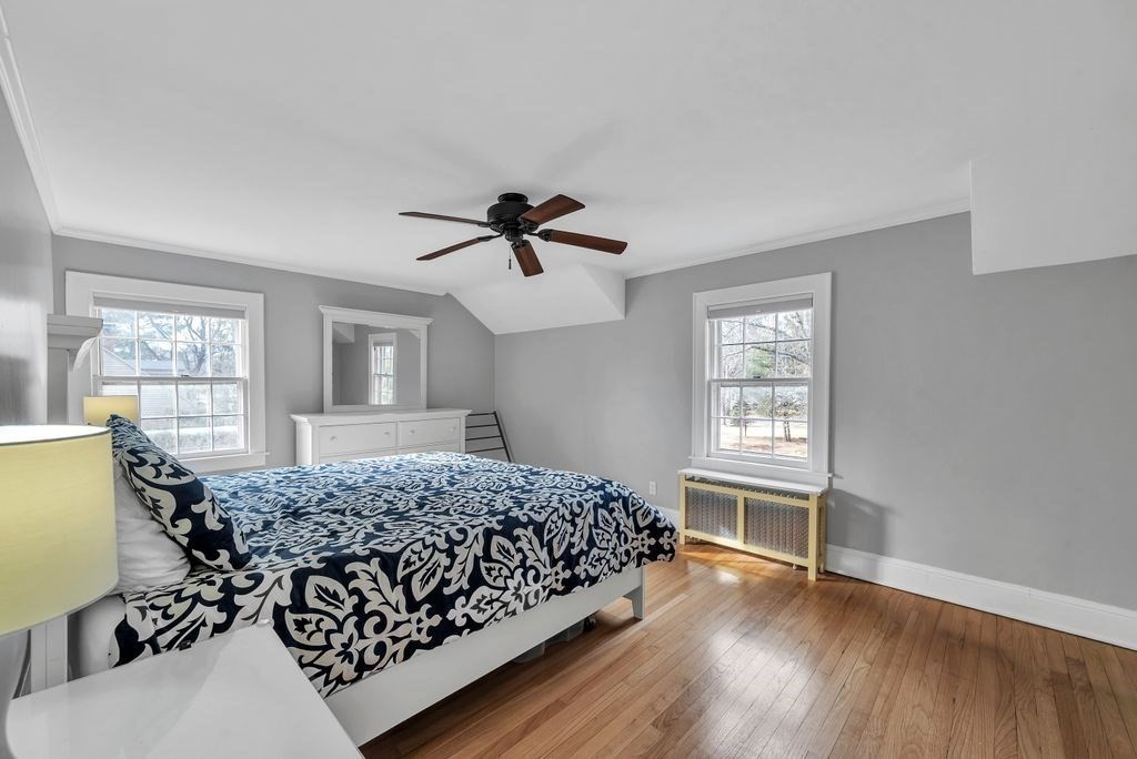 106 Granville Road Westfield, MA 01085 - Photo 28 of 42 a bedroom with a bed and wooden floor