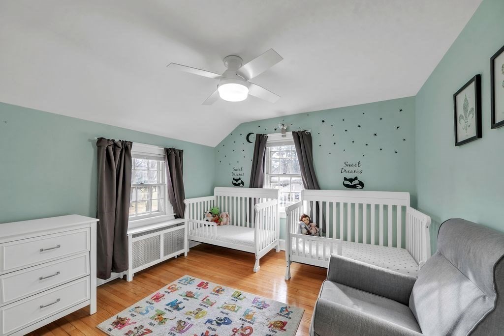 106 Granville Road Westfield, MA 01085 - Photo 32 of 42 a living room with furniture and a baby crib